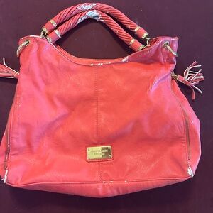 Pink/peach large Michael Kors purse.